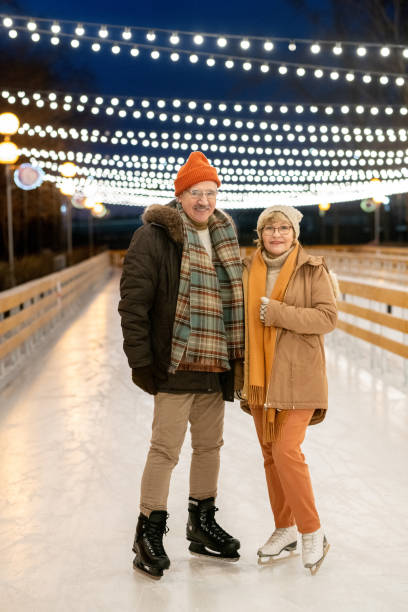 istock Mature couple skating together 1297603945