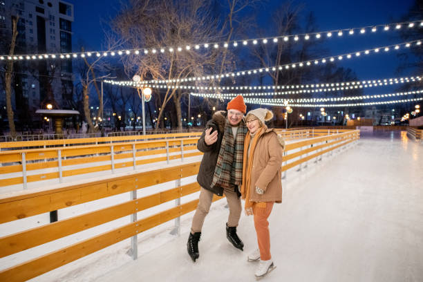 istock Family of two on ice rink 1297603967