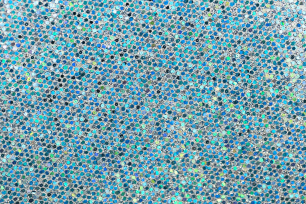 istock Sparkling abstract background. Light blue shiny texture close-up. Macro shot of the glitter paper 1297604155