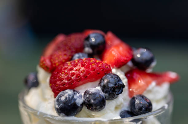 istock Sweet dessert - meringue with strawberries and blueberries 1297604530