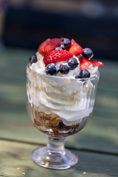 istock Sweet dessert - meringue with strawberries and blueberries 1297604593