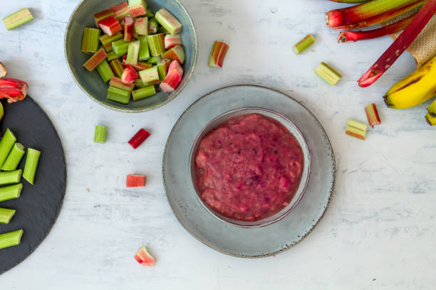 Homemade rhubarb compote A bowl of delicious homemade rhubarb compote compote stock pictures, royalty-free photos & images