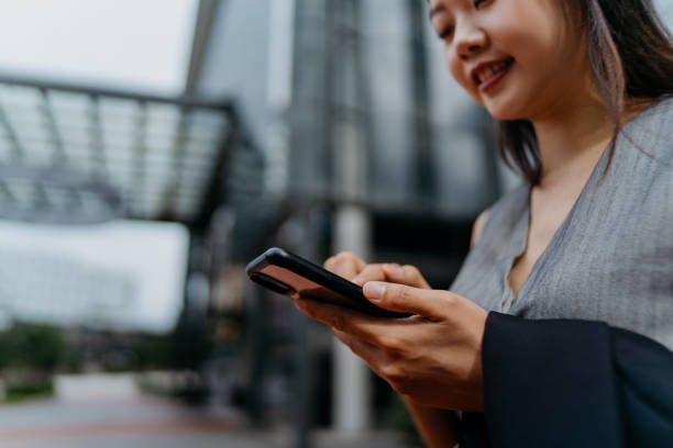 istock Confidence young asian businesswoman using smartphone 1297607549