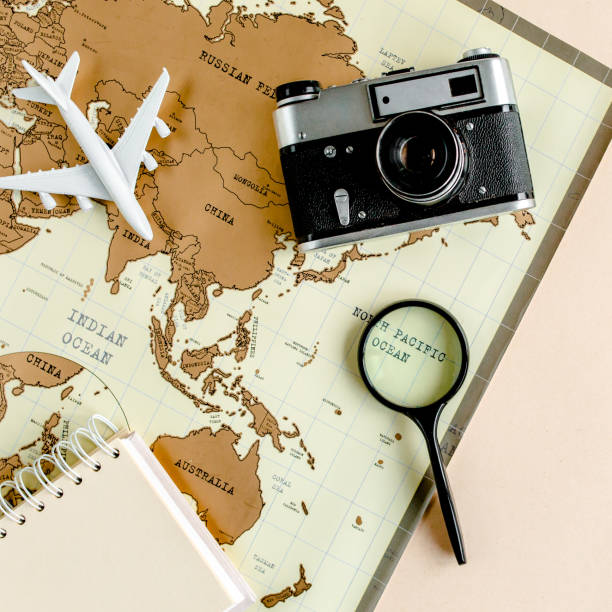 istock Planning vacation, travel plan, trip vacation using world map along with other travel accessories. Top view, flat lay 1297613473