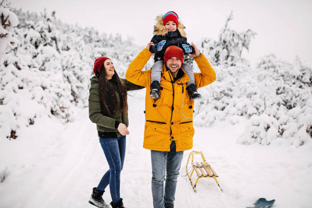 istock Happy family enjoying the snow 1297614404