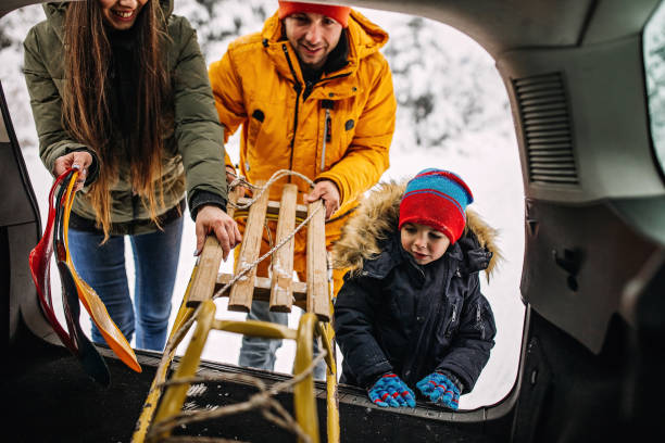 istock Family going to have some fun with sleds on snow 1297614866