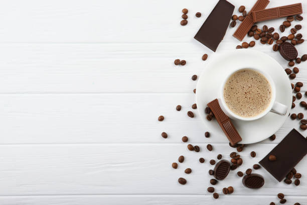 istock cup of coffee, coffee beans and chocolate on the table close up 1297614967