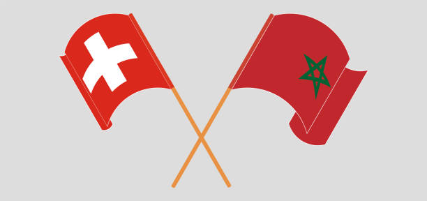 скрещенные и развевающиеся флаги швейцарии и марокко - helvetic confederation stock illustrations