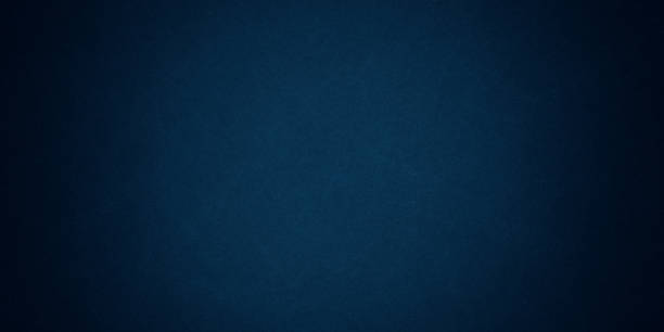istock Texture of old navy grunge blue paper closeup background 1297615714