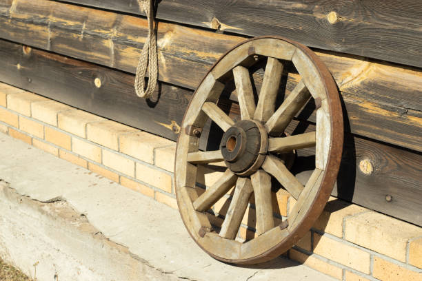 istock Old wooden wheel from a chariot with copy space 1297616218