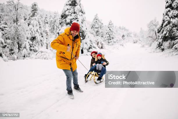 Sleighing Time Stock Photo - Download Image Now - Family, Snow, Winter