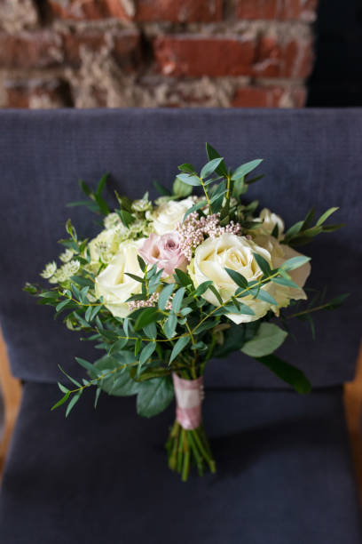 istock Wedding bouquet of the bride with roses 1297617843