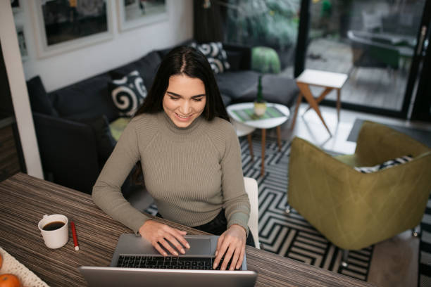 istock High angle view of an attractive Caucasian female student using a laptop 1297619146