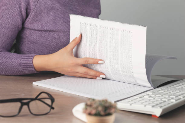 istock woman hand pen with document on working desk 1297620671