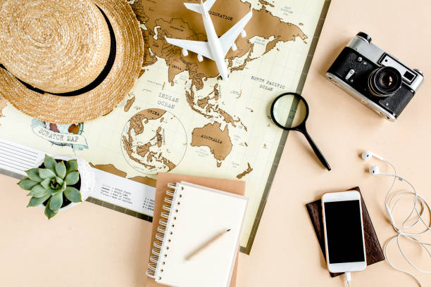 istock Planning vacation, travel plan, trip vacation using world map along with other travel accessories. Top view, flat lay 1297620718