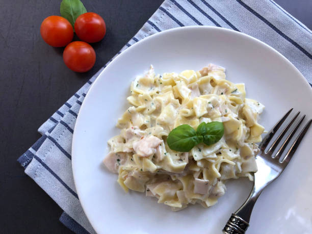 istock Ham Pasta specialty, Schinkenfleckerl in sour cream sauce. 1297621509