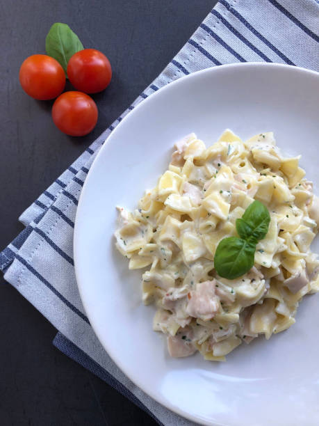 istock Ham Pasta specialty, Schinkenfleckerl in sour cream sauce. 1297621515