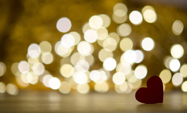 istock One red wooden hearts on bokeh background 1297621599