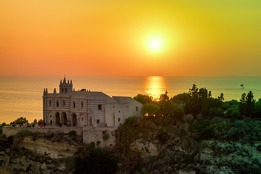 Tropea, Italy August 2020: The Sanctuary of Santa Maria dell'Isola of Tropea at sunset, Calabria, Italy. Landmarks of Calabria, iconic church in Tropea.