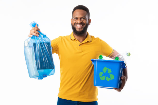 istock Man Holding Box With Litter And Garbage Bag, White Background 1297624325