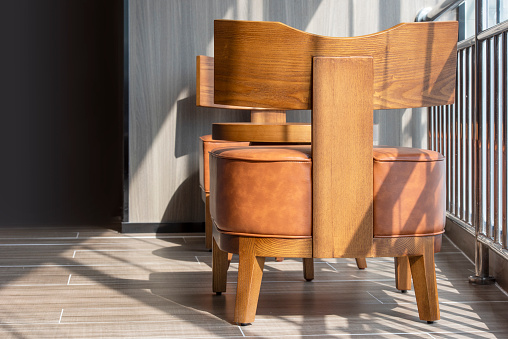 The shadow of a wooden chair in the sun