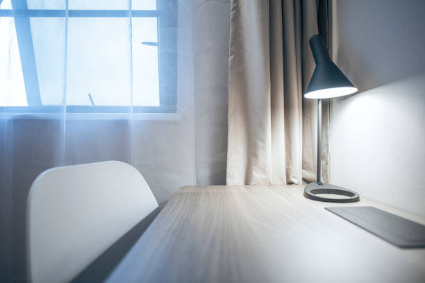istock Warm clean bedroom with white sheets and white pillows 1297624691