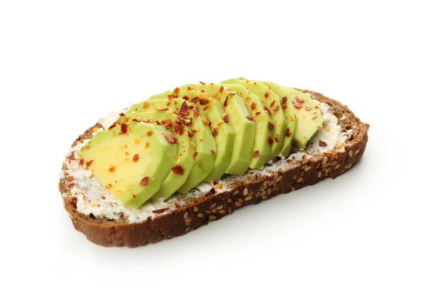 istock Delicious toast with avocado isolated on white background 1297625833