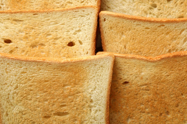 istock Tasty toast breads on whole background, close up 1297625879
