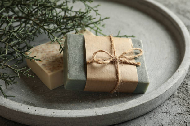istock Tray with natural handmade soap on gray background 1297626739