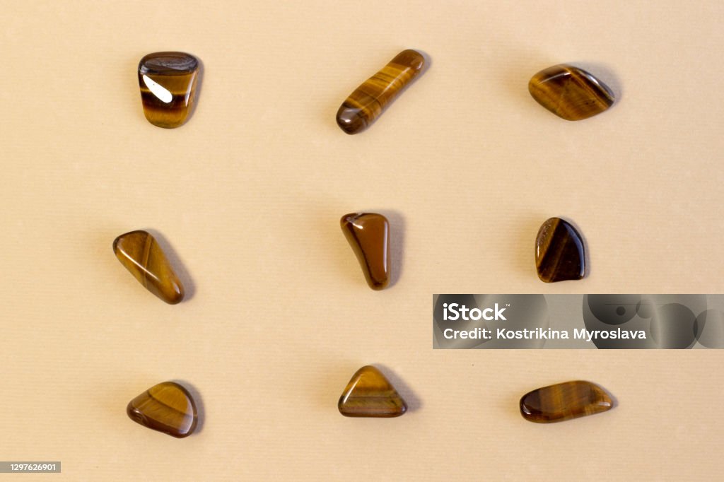 Natural mineral gem stone Tiger's eye Tigers eye, Tiger eye gemstone on beige background close up Natural mineral gem stone Tiger's eye Tigers eye, Tiger eye gemstone isolated on beige background close up top view Tiger-Eye Stock Photo Natural mineral gem stone Tiger's eye Tigers eye, Tiger eye gemstone on beige background close up Natural mineral gem stone Tiger's eye Tigers eye, Tiger eye gemstone isolated on beige background close up top view Tiger-Eye Stock Photo