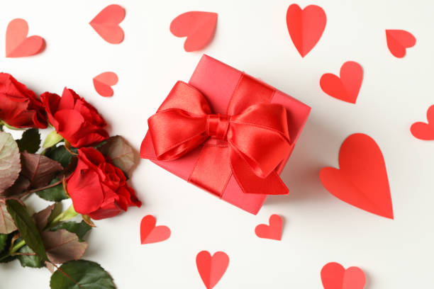 istock Gift box, roses and hearts on white background 1297626930