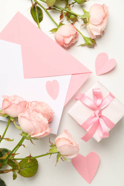 istock Envelope, roses, hearts and gift box on white background 1297627007