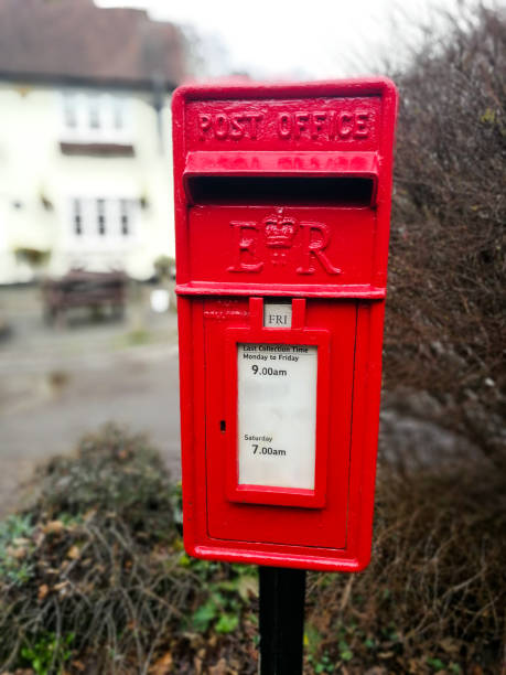 istock Traditional British red public mailbox in the countryside 1297628568