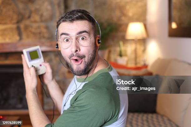 Retro Guy Gaming With Headphones Stock Photo - Download Image Now - Video Game, Retro Style, Gamer