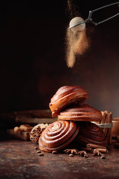 istock Freshly baked sweet buns sprinkled with cinnamon powder. 1297628979