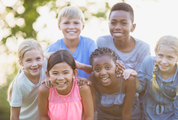 istock Multi ethnic group of children outdoors 1297630413