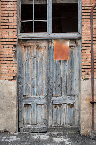 Old ruined vintage door in Tiblisi, the capital city of Georgia