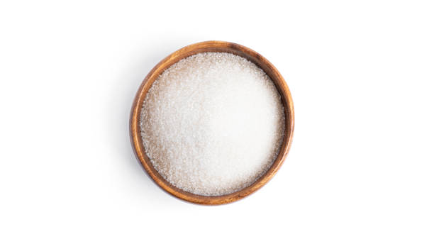 istock Sugar in a wooden bowl isolated on a white background 1297633415
