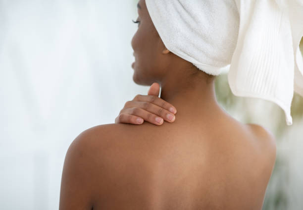 istock Moisturizing skin after shower at home and spa procedure at covid-19 lockdown 1297634717