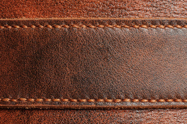 ブラウンレザータグ - leather sewing label patch ストックフォトと画像