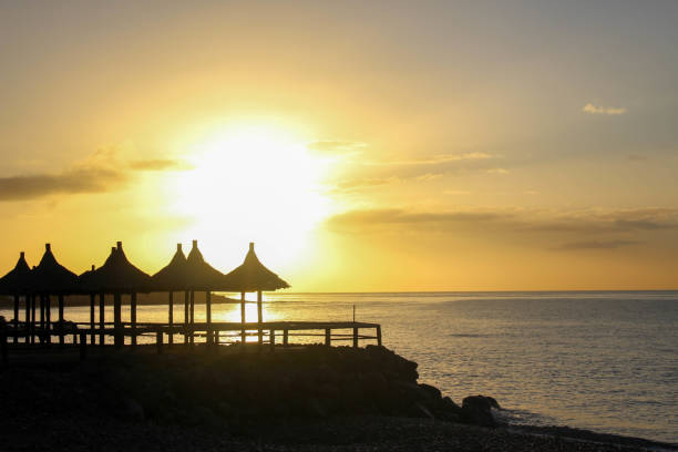 istock Sunrise by the sea 1297635775
