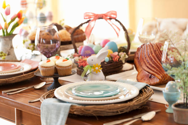 Easter Dining Easter Dining with Light Blue Place Setting and Focus on Ham carrot cake day stock pictures, royalty-free photos & images