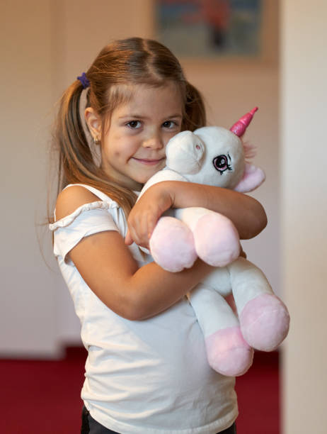 istock Little girl holding her toy 1297637511