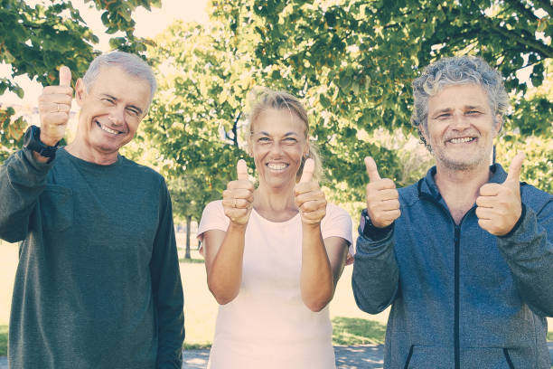 istock Cheerful sporty mature people standing together after 1297638202