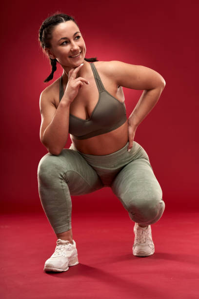 istock Plus size woman doing fitness exercises 1297638288