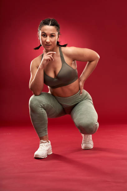 istock Plus size woman doing fitness exercises 1297638296