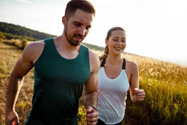 istock Two young athletes running in nature on sunny day 1297638734