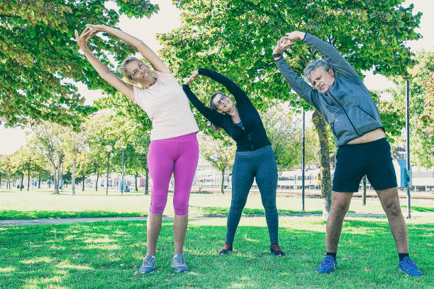 istock Active sporty mature people doing morning exercise 1297638791