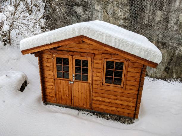 istock Snow covered wooden house 1297640247