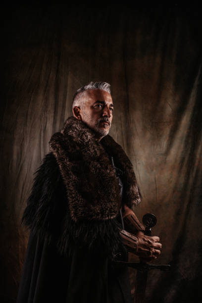 istock Strong fantasy knight with sword and with thoughtful gaze 1297641363